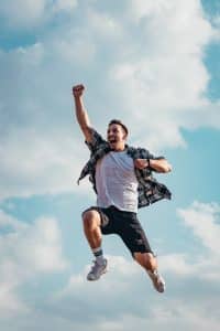 An image of a happy man illustrates the joy of winning after using the win lotto spells from African traditional healers.