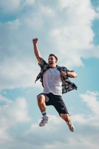 An image of a happy man illustrates the joy of winning after using the win lotto spells from African traditional healers.