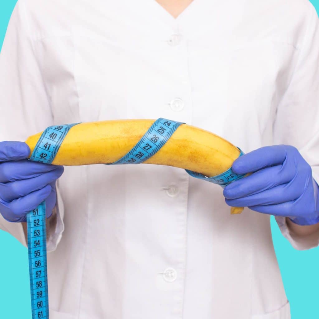 A picture of a banana wrapped in a measuring tape demonstrates one way to calculate the average size penis.