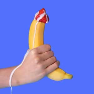 An image of a handheld banana illustrating the benefits of a penis enlargement spell.