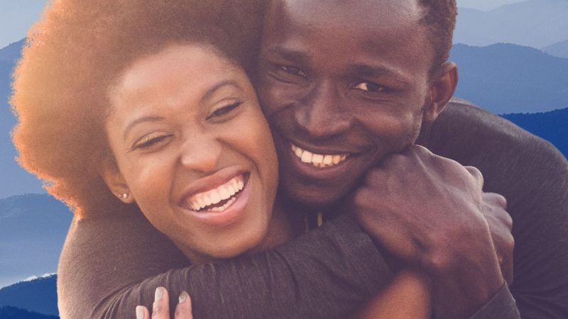 An image of a happy man and woman demonstrates the benefits of using a love candle spell.