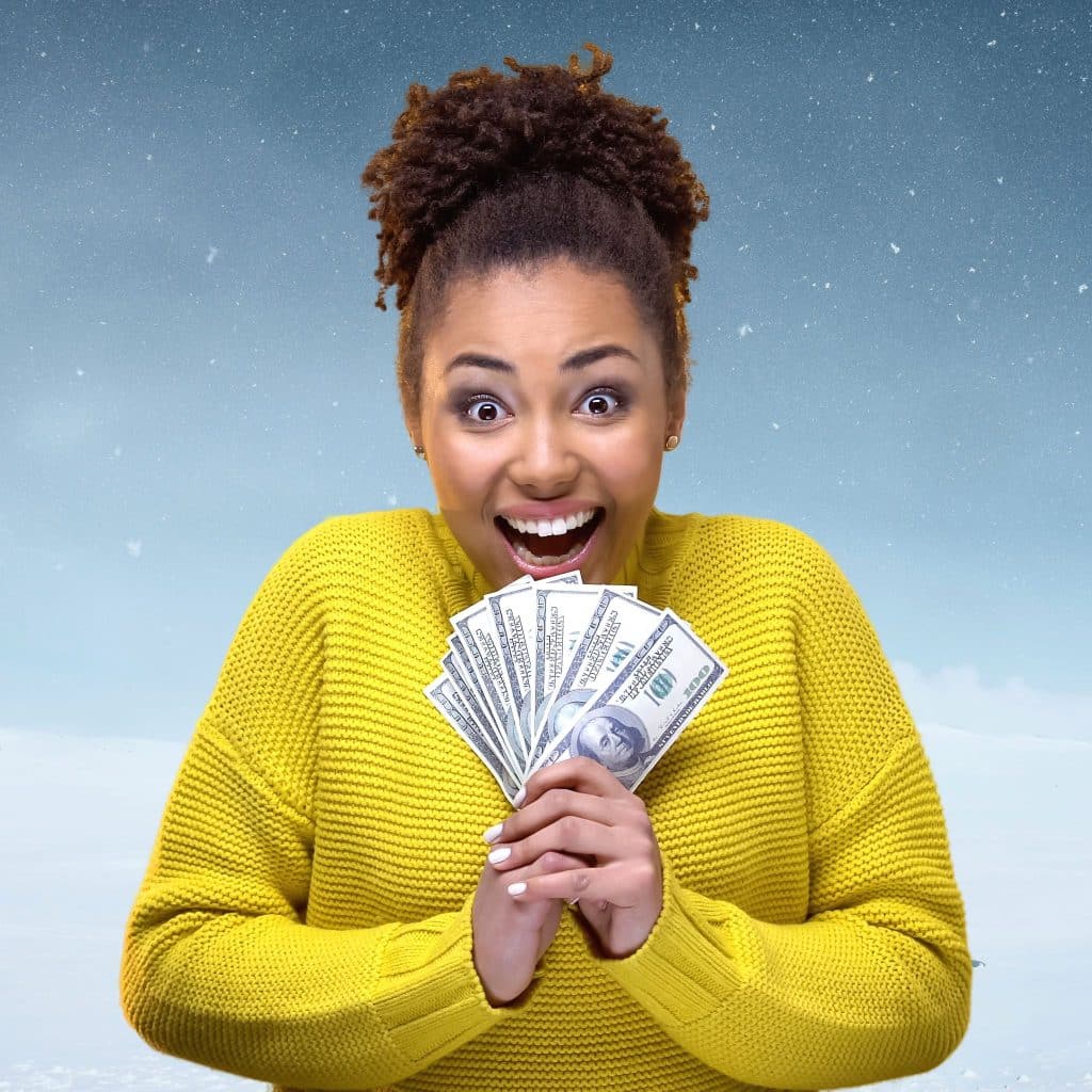 A woman with cash in her hands after winning with megabucks numbers