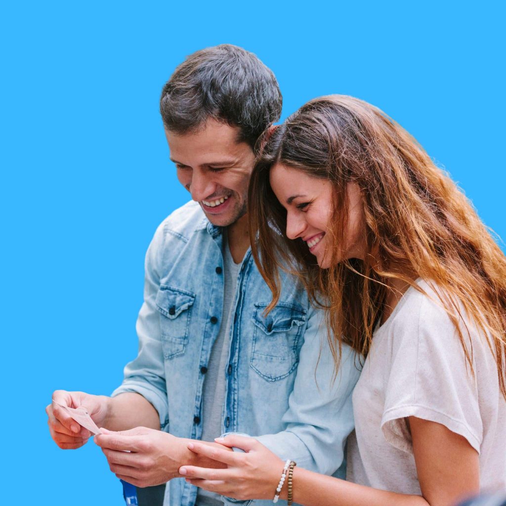 An image shows a happy man and woman after realizing they selected the winning megabucks numbers