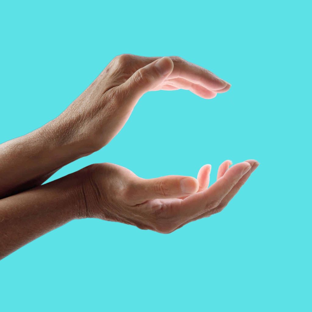 A photo of hands making a gesture native healers usually use when performing their duties