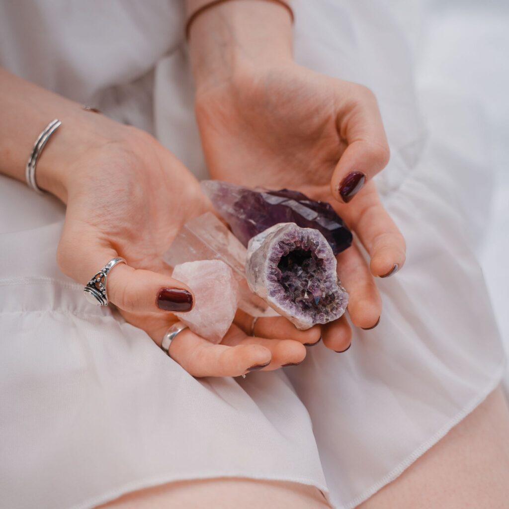 A woman carrying crystals for love attraction in her hands